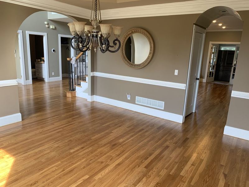 Dining room with chair rail and a natural oak floor