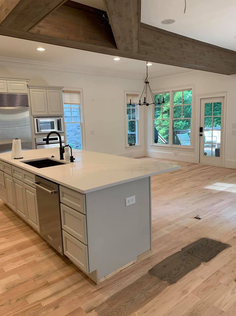 Kitchen and family room floor sanded to bare wood