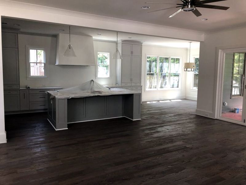 New-construction kitchen with a dark stained oak floor